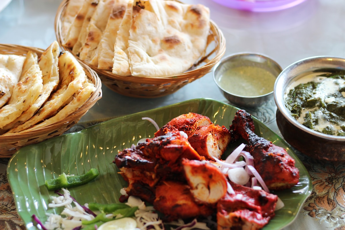 Tandoori chicken with naan and greens